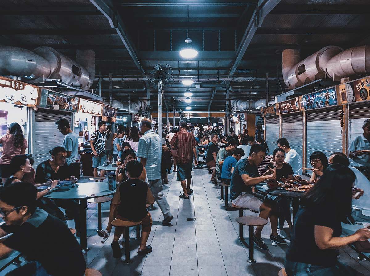person group of people sitting in front of tables human