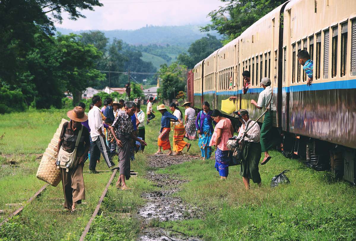 human group of people standing outside train train