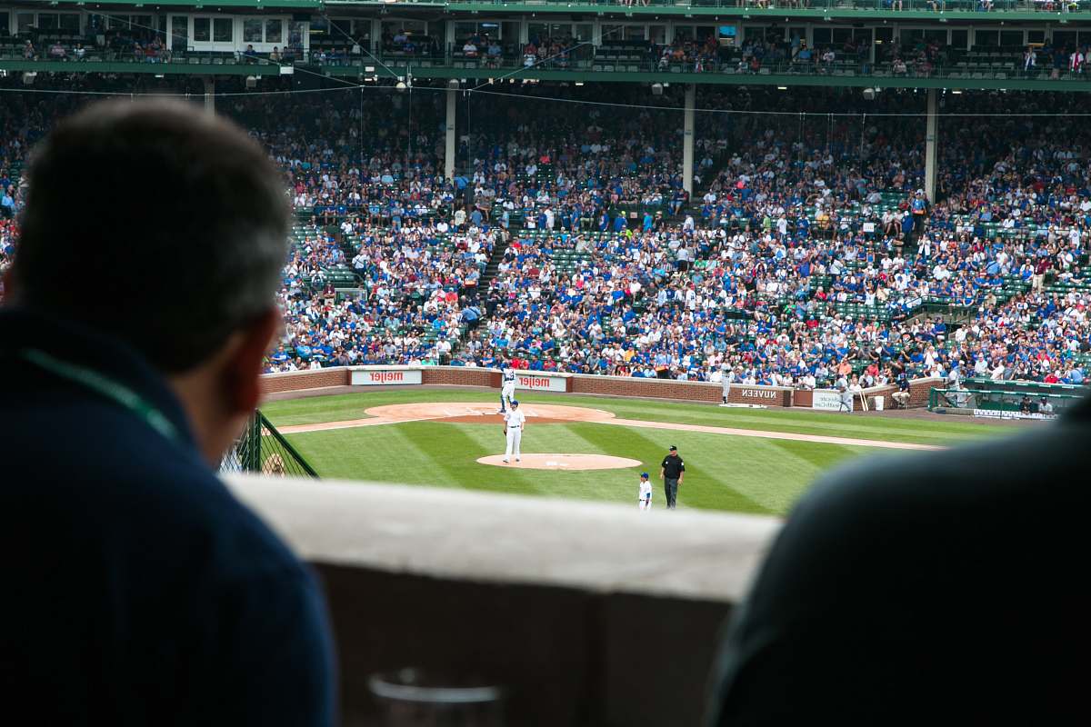 person group of people watching baseball game baseball
