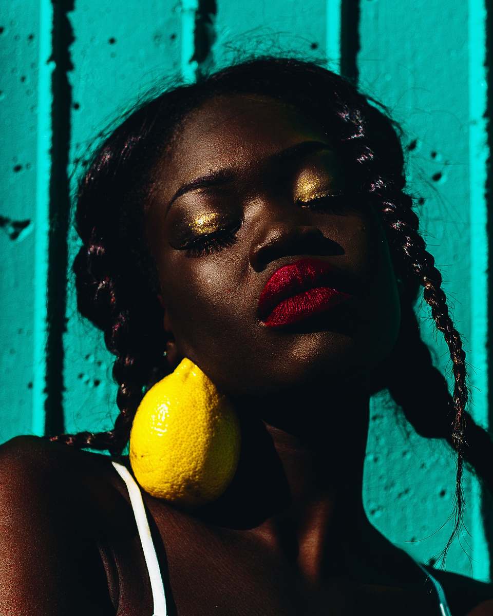 person lemon on women's neck woman