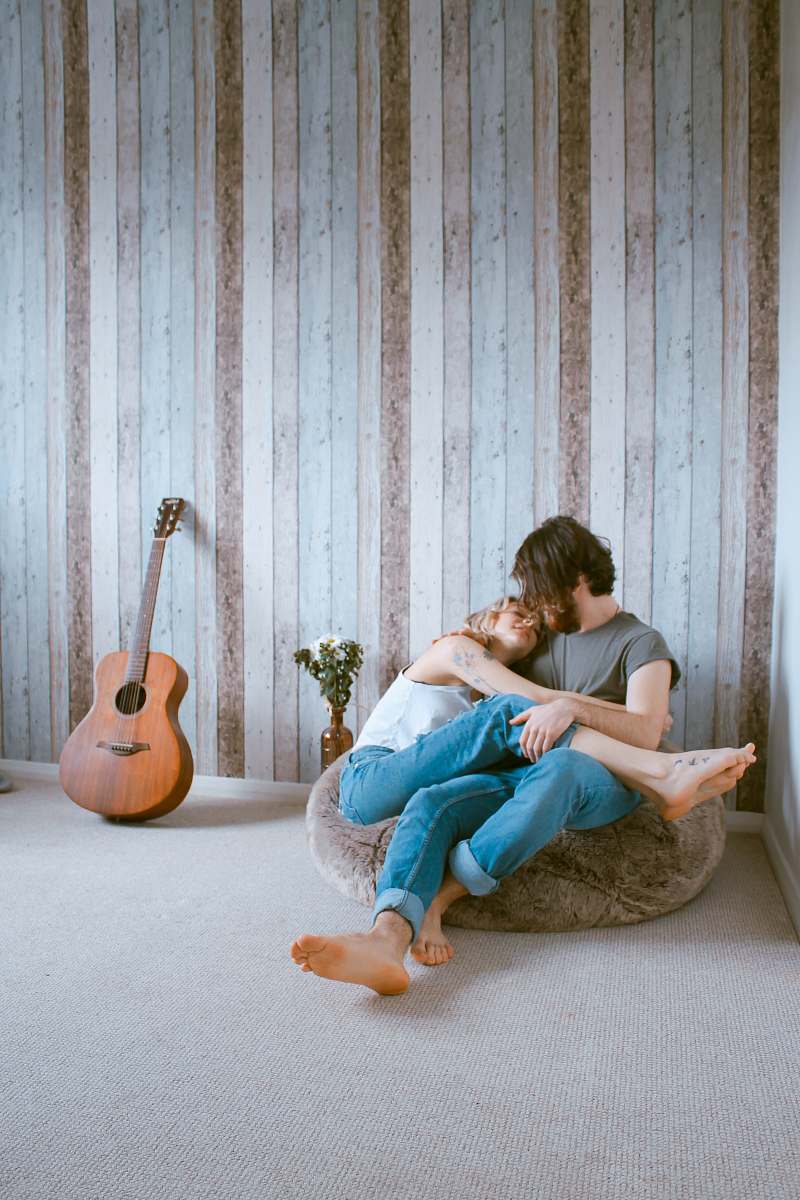 couple man and woman sitting on gray beanbag love