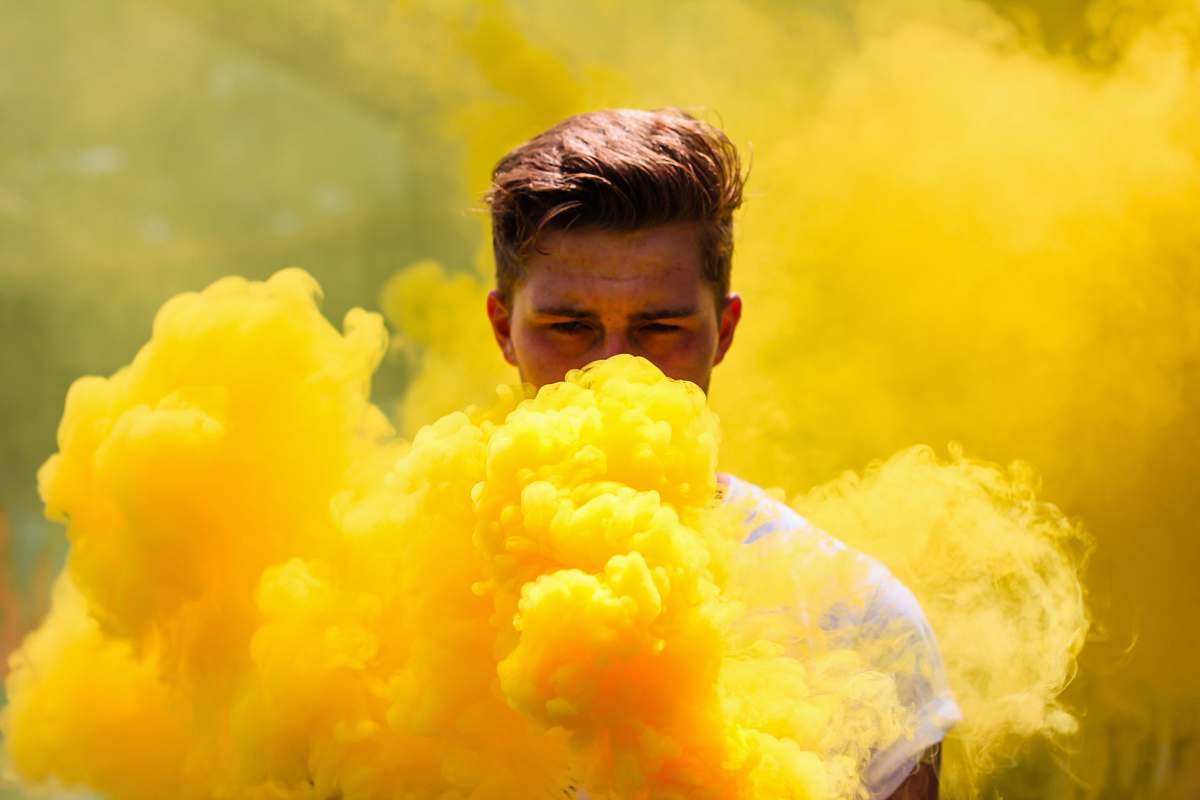 yellow man hiding in smoke smoke