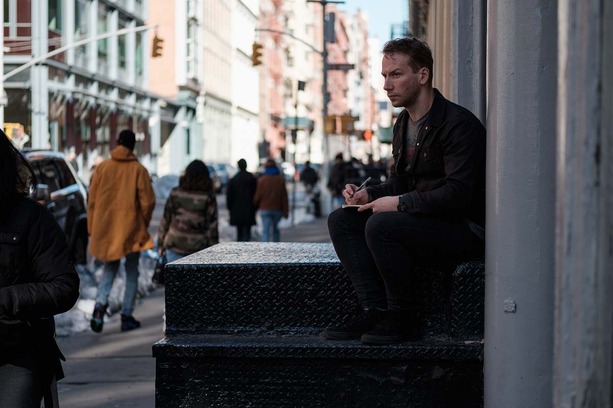 person man sitting on ladder human