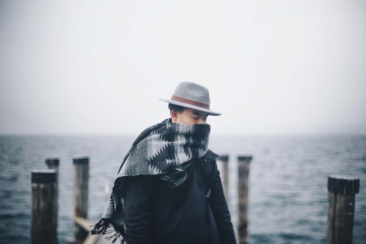 person man standing on dock during day time human