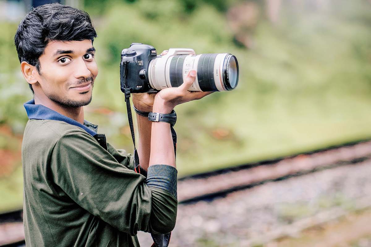 human man taking photo in selective focus photography photographer