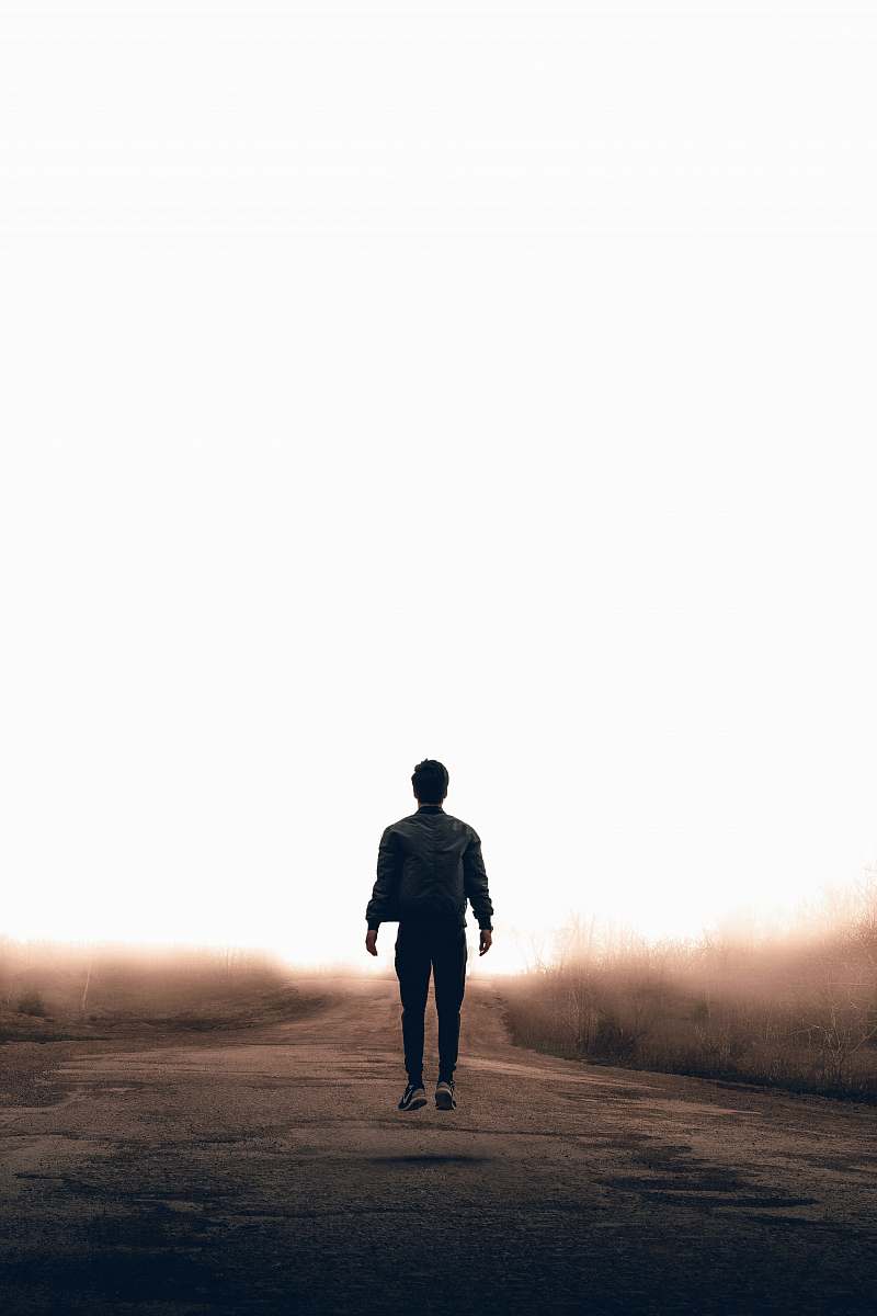 human man walking along road person