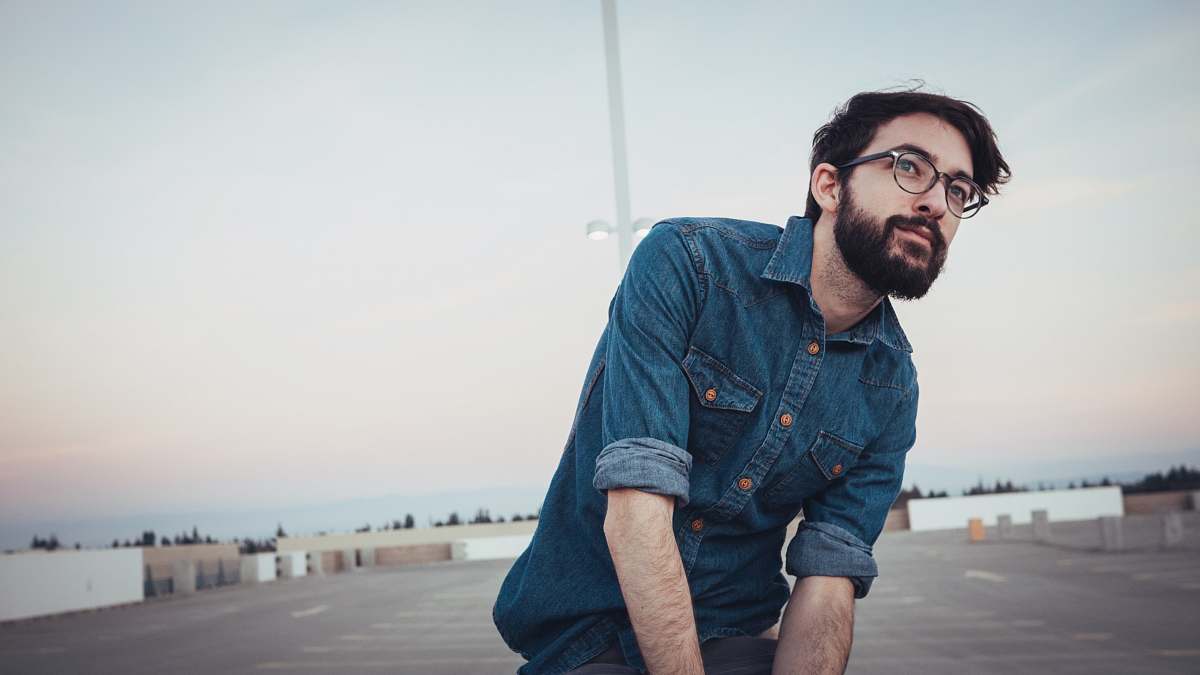 person man wearing denim sport shirt and sunglasses on concrete flooring denim