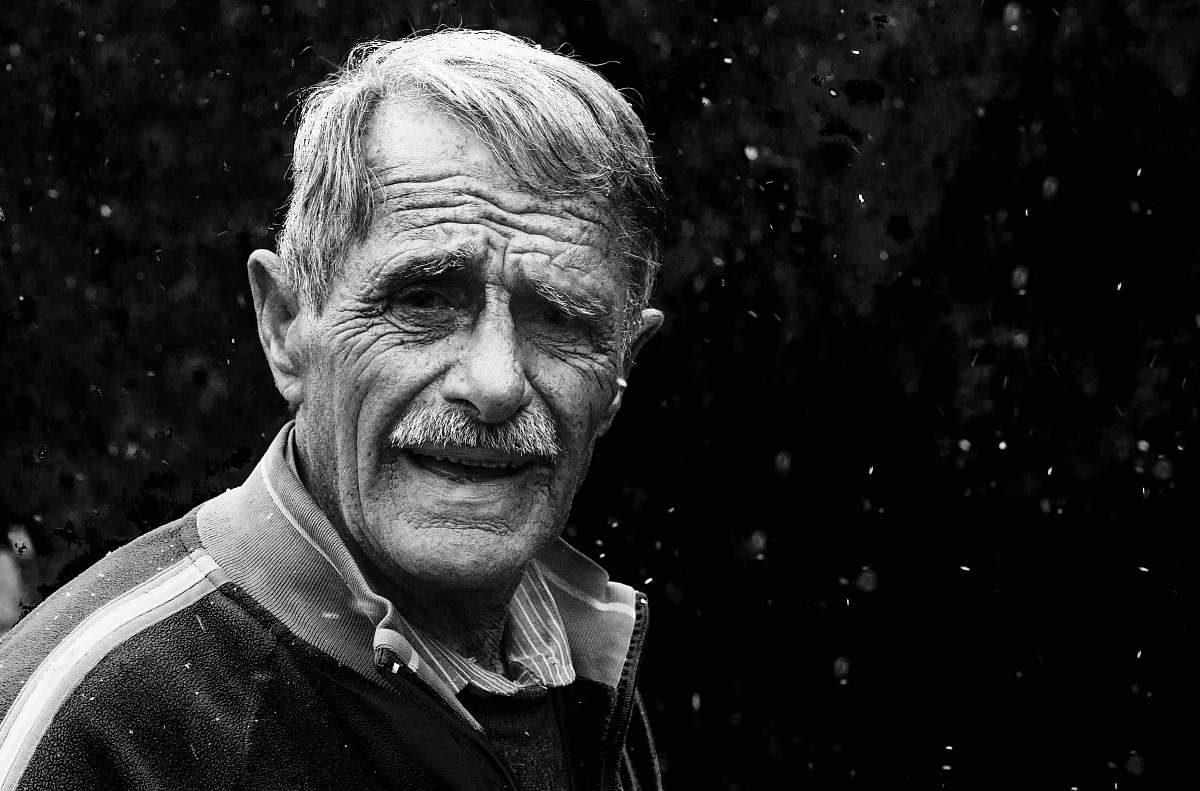 black-and-white man wearing jacket portrait photograph portrait
