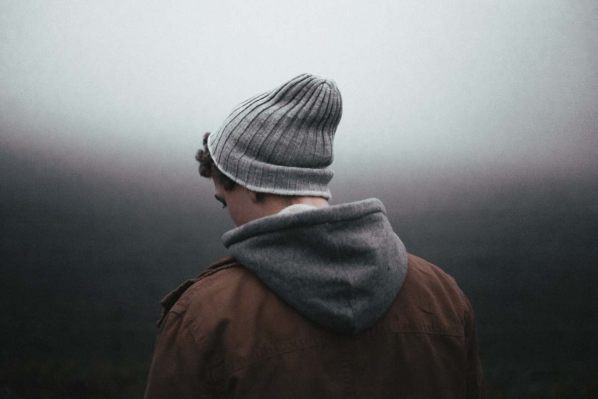 person man wearing knit cap on grey background grey