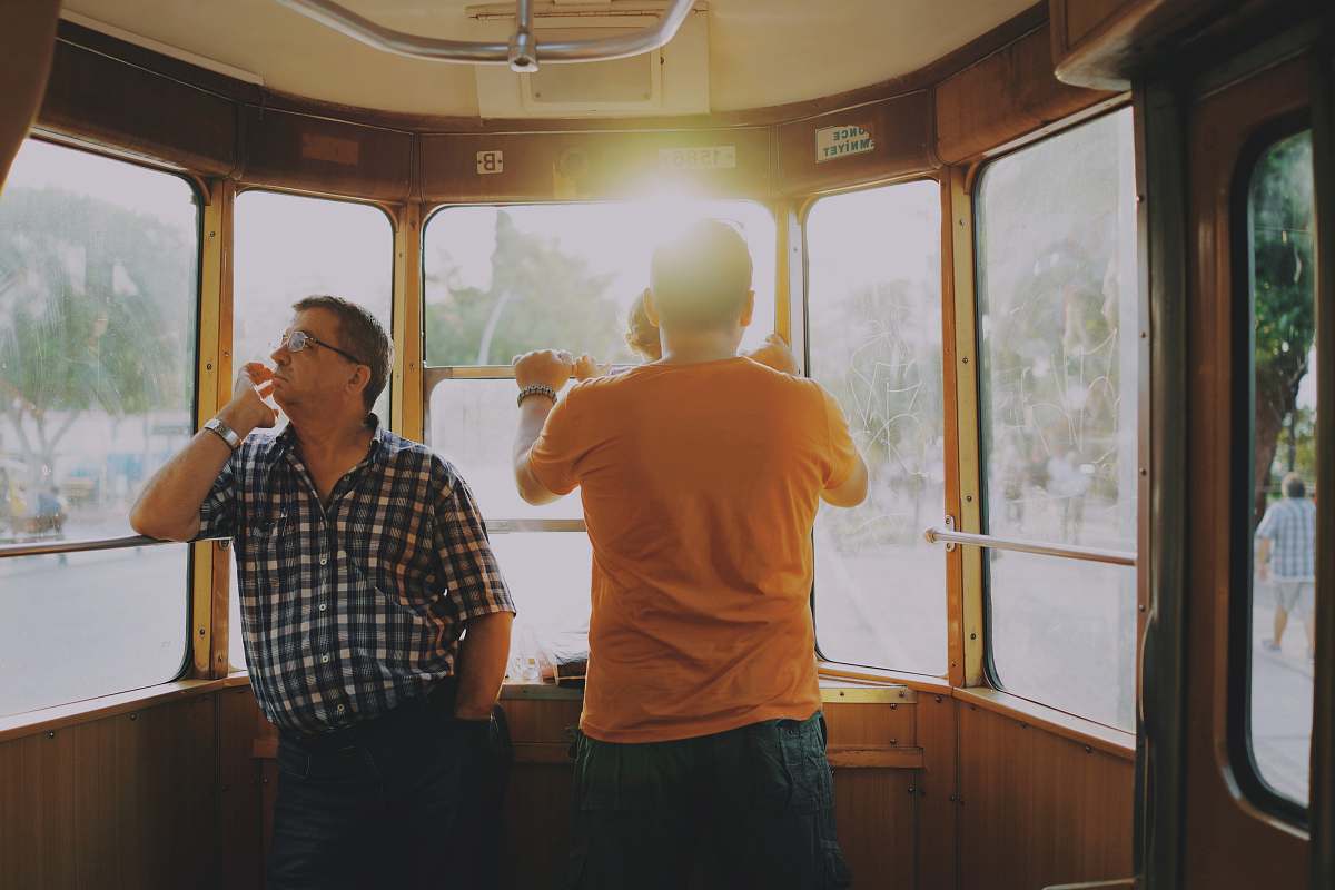person men standing inside of train human