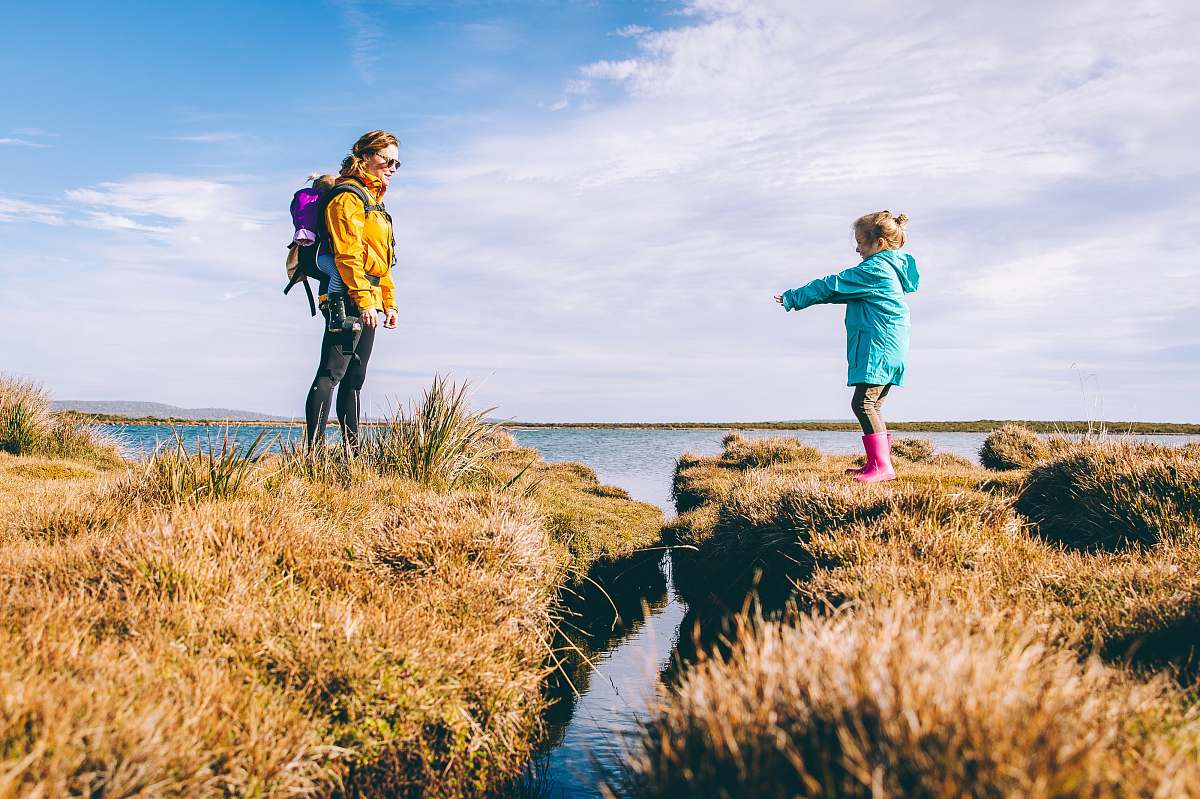 person mother and daughter standing on cliffs human