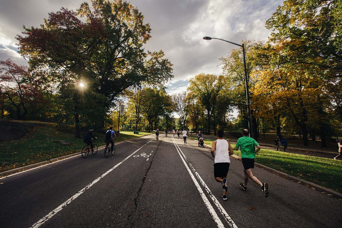 human people running and riding bicycle sport