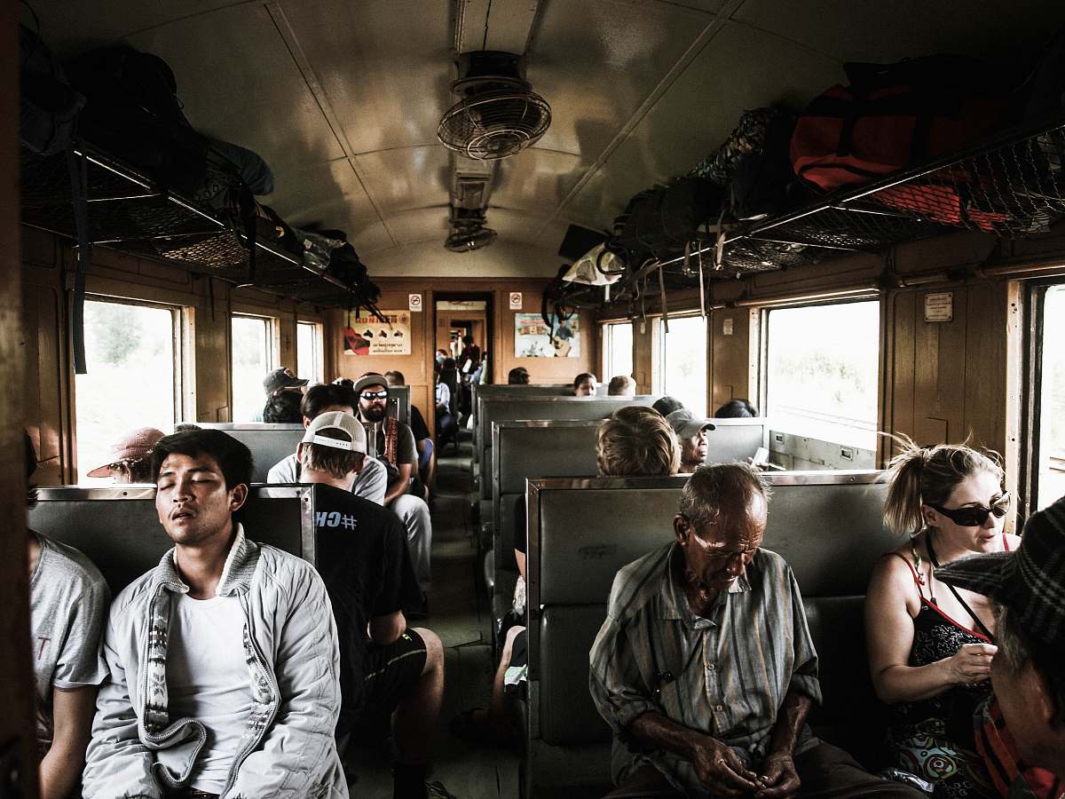 person people sitting inside train human