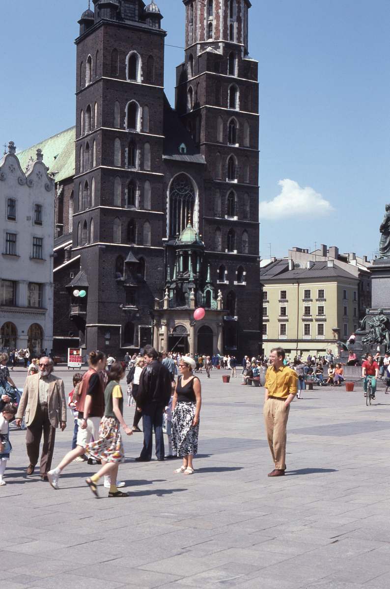 crowd people standing beside concrete cathedral architecture