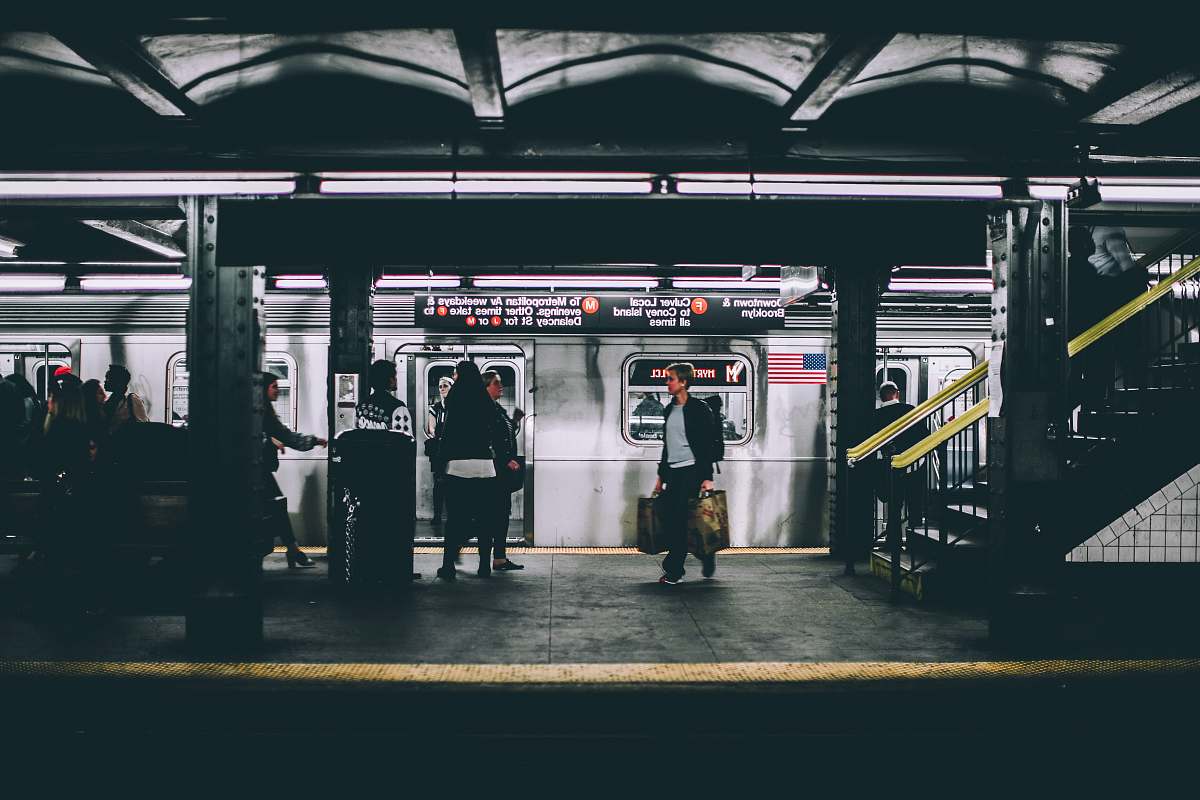 subway people standing near train train station