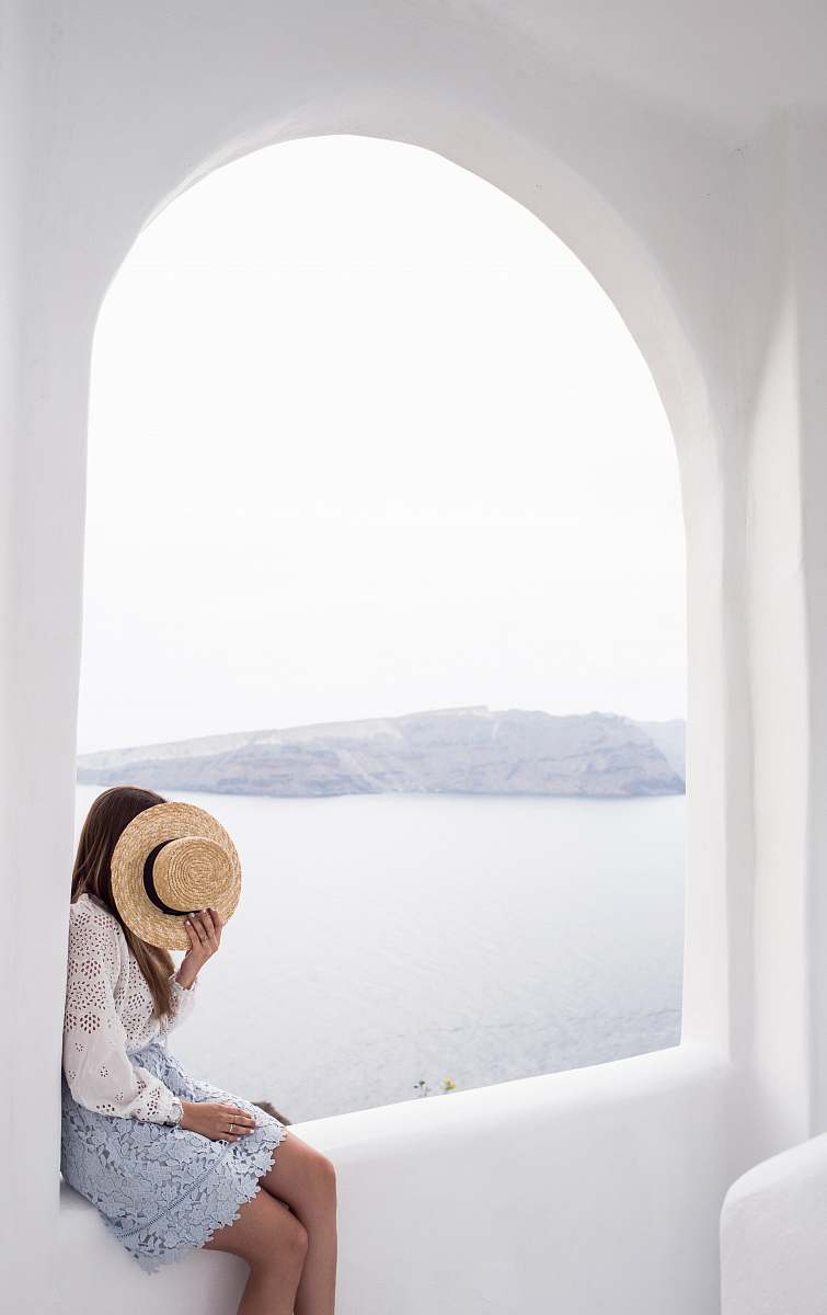 person person holding hat sitting on edge human