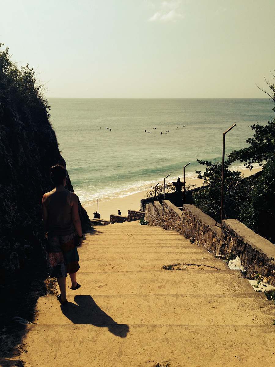person person in gray tank top walking down to shore human