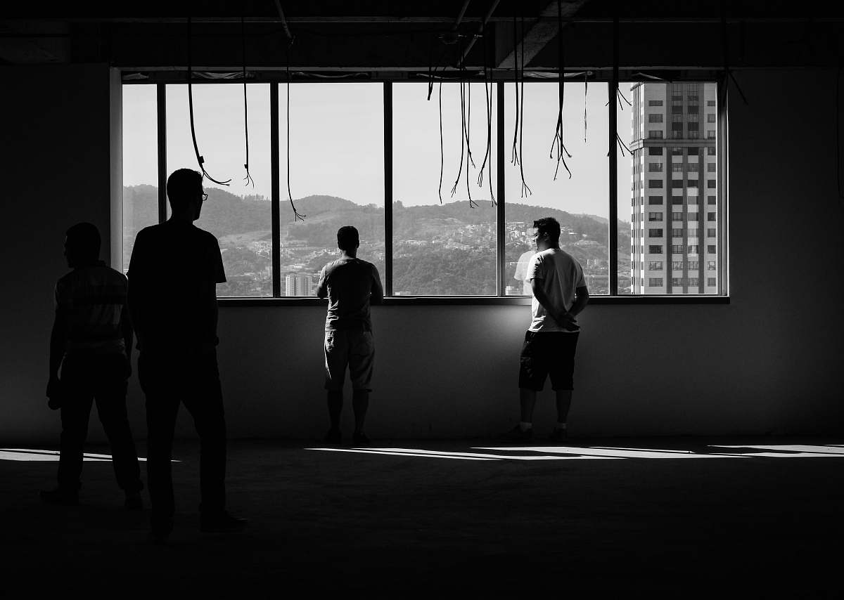 person person standing beside of mirror black-and-white