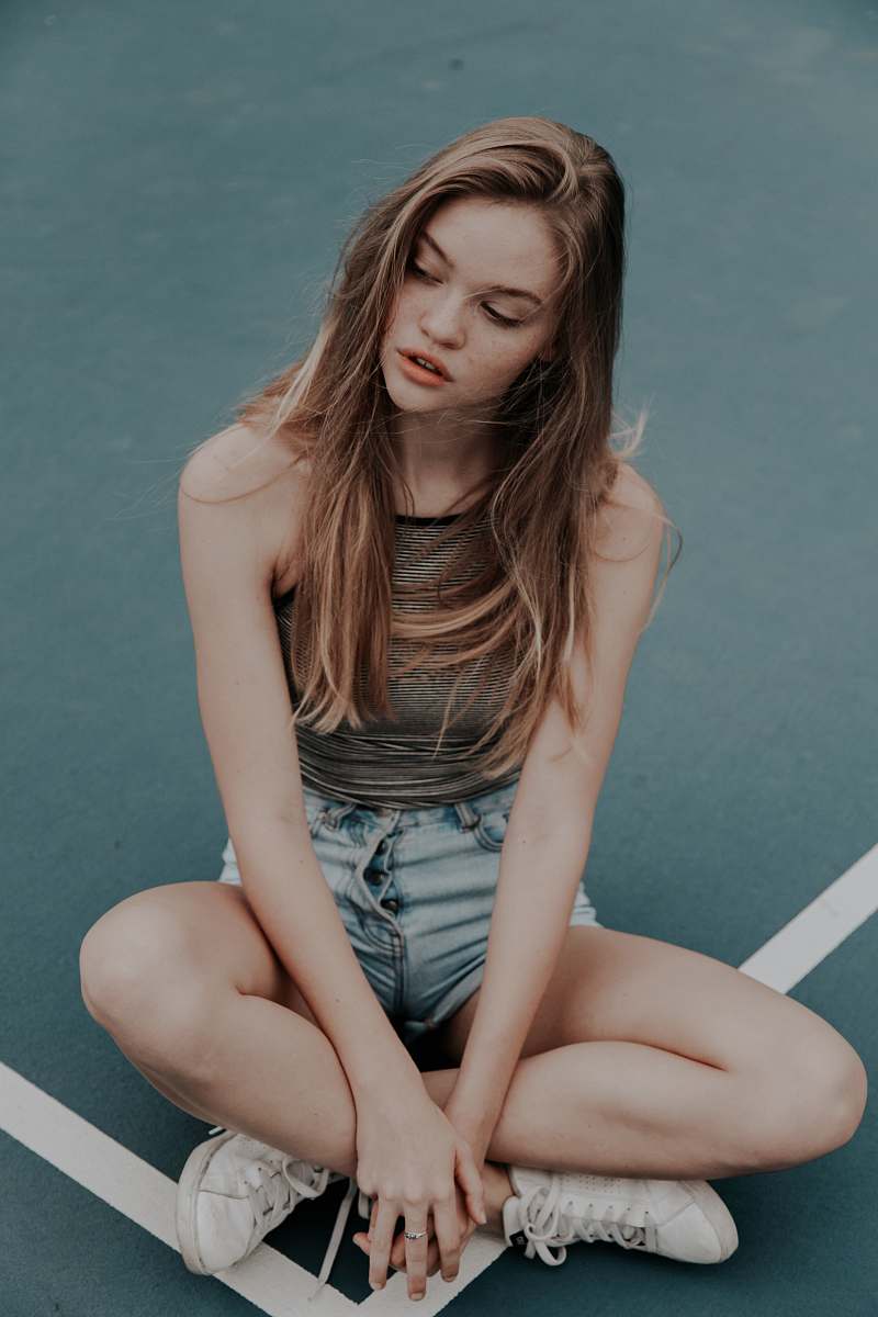 person photo of blonde-haired woman sitting on floor human