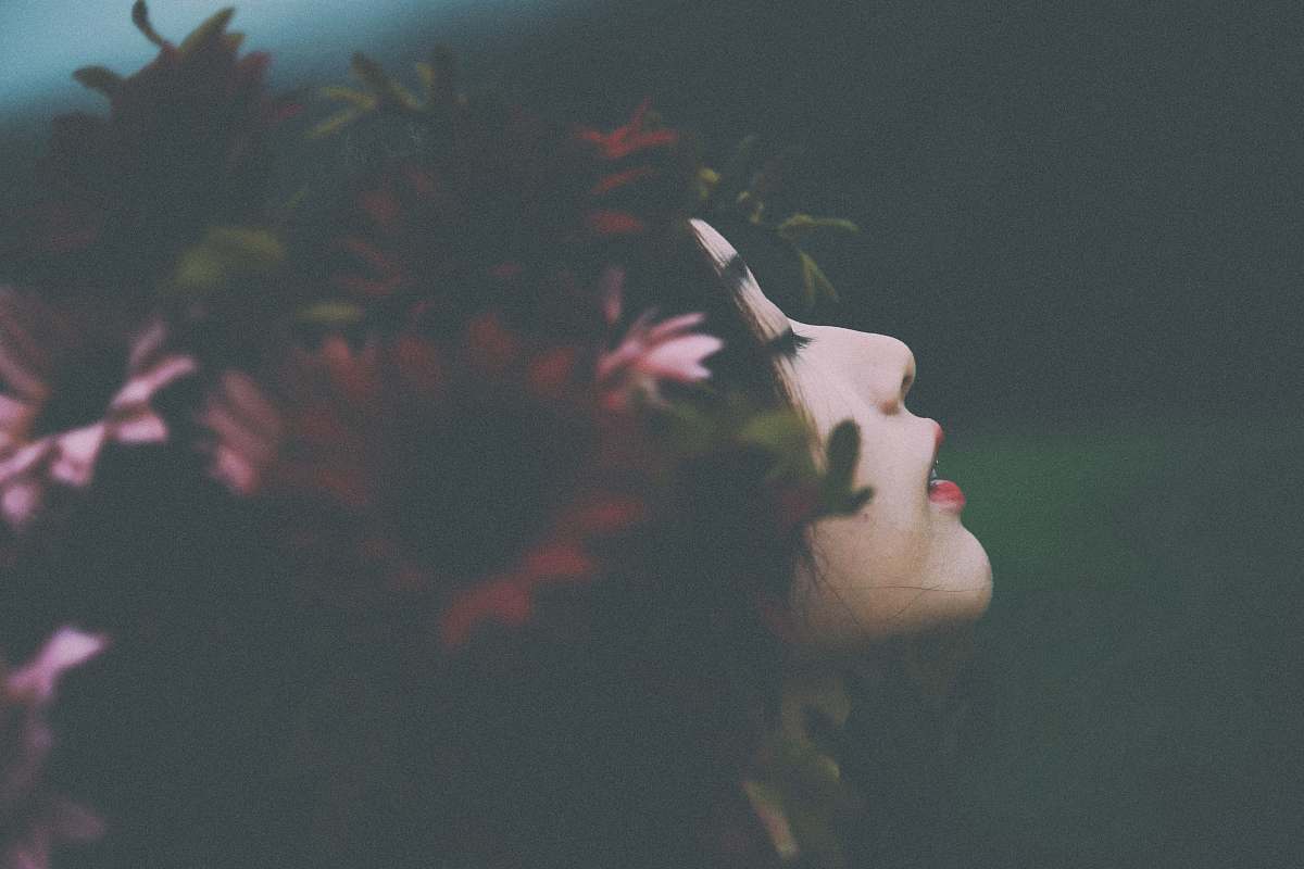woman red and pink flower headdress on woman's head female