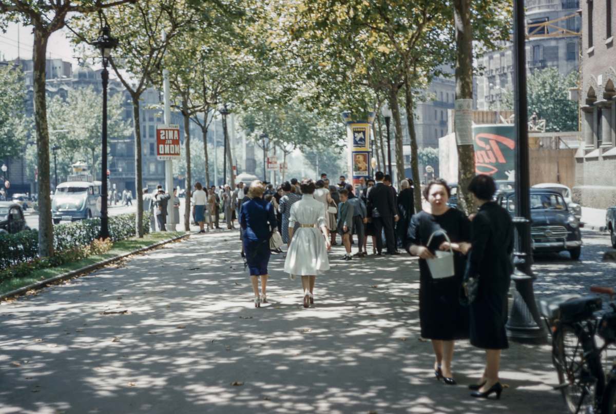 human several people walking on road under blue sky vintage