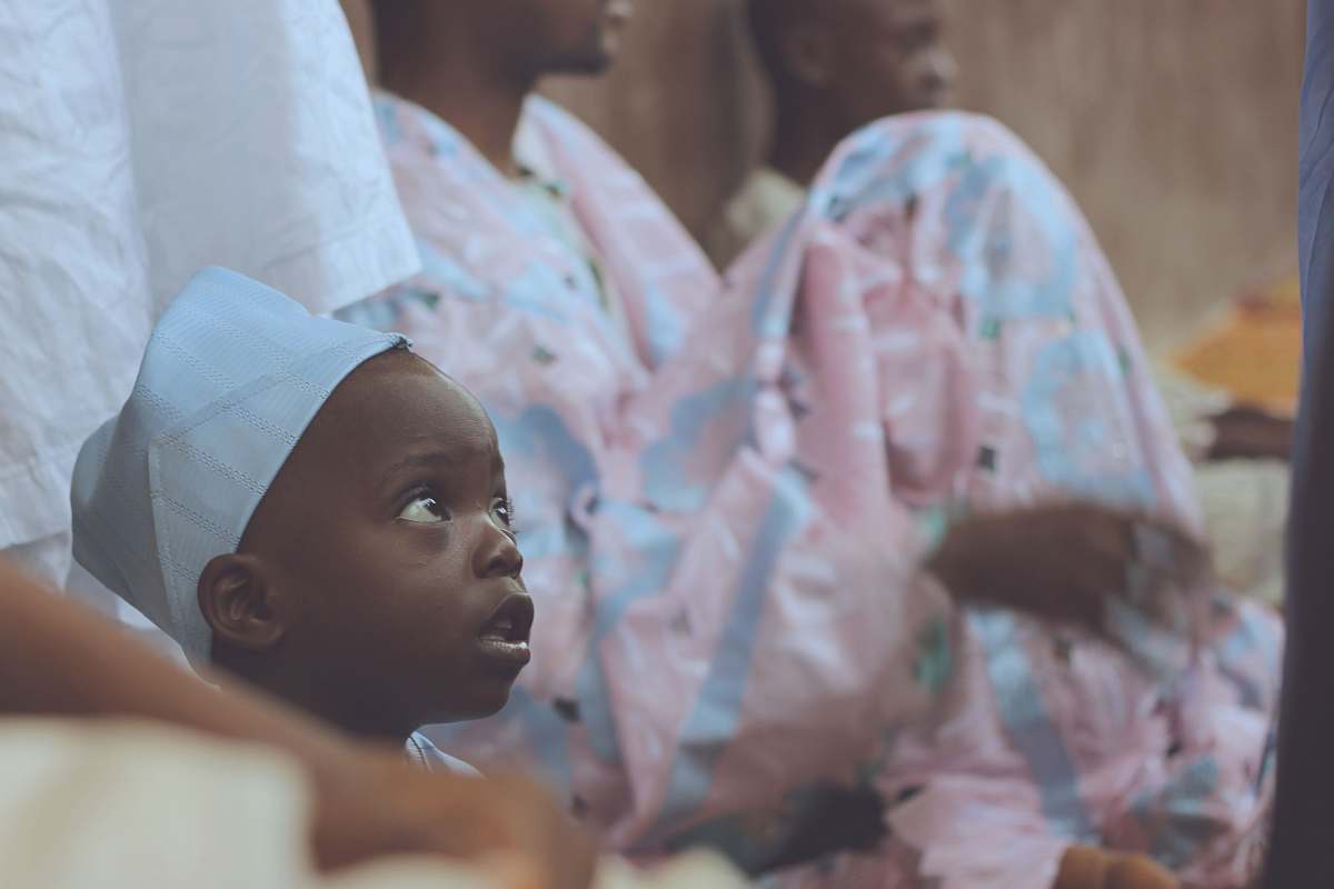 human shallow focus photography of boy with white hat person