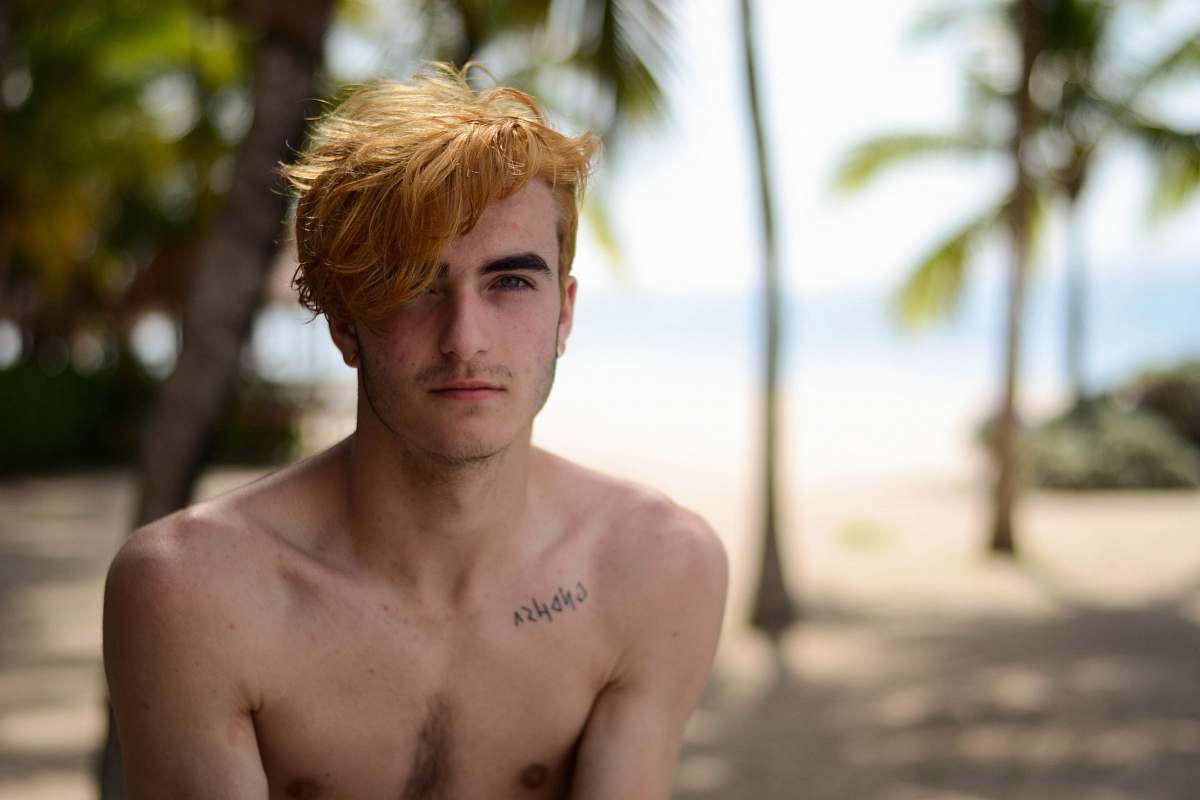 person shallow focus photography of man in beach beach