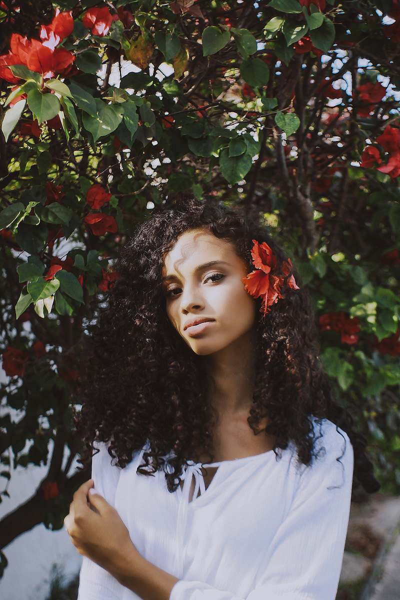 person shallow focus photography of woman standing beside tree woman