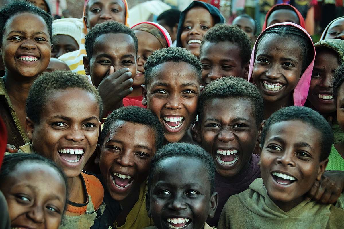 person smiling children gathering taken during daytime tribe