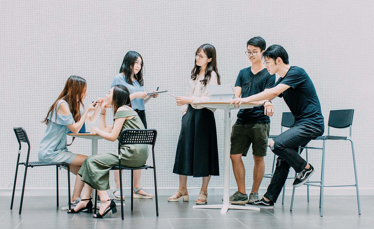 person two men and four women meeting in office chair