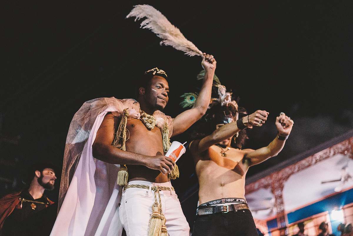 person two topless men performing new orleans