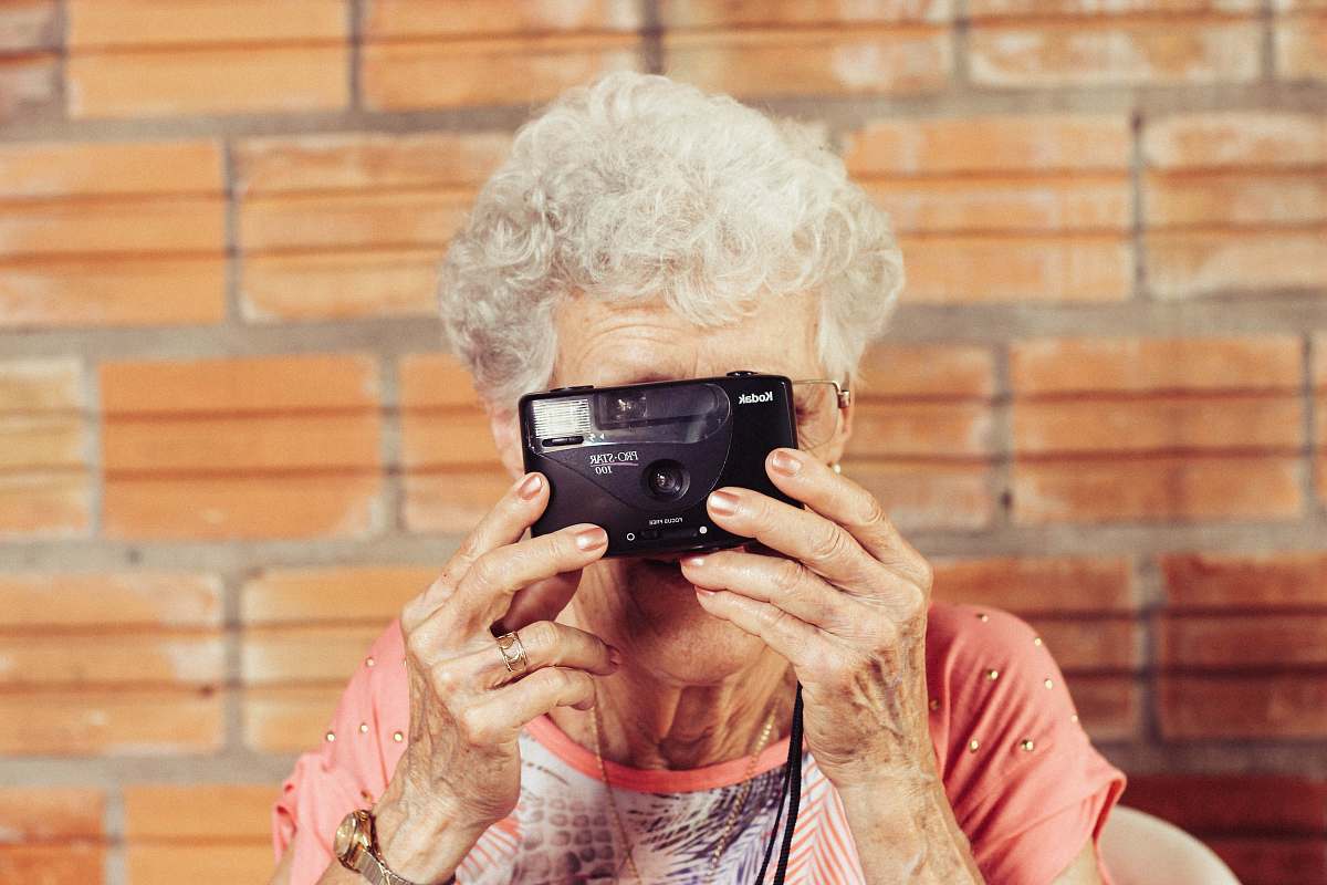 human woman holding film camera woman