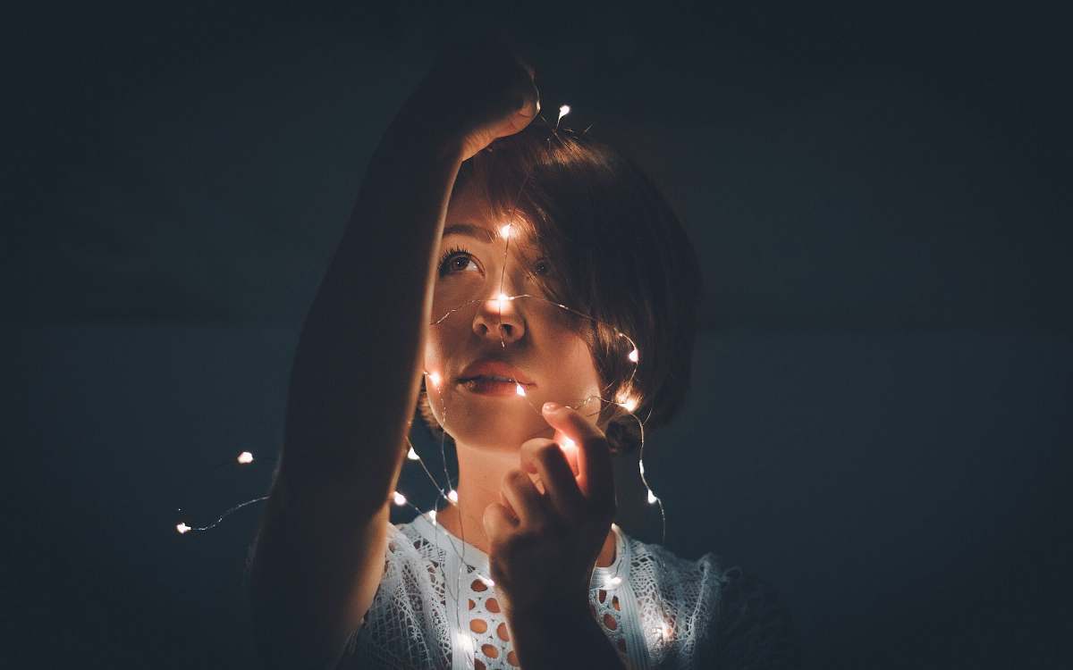 Person Woman Holding Light String In A Dark Room Woman Image Free Stock Photo