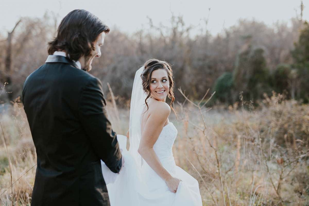 person woman in white wedding dress and man in black suit jacket wedding
