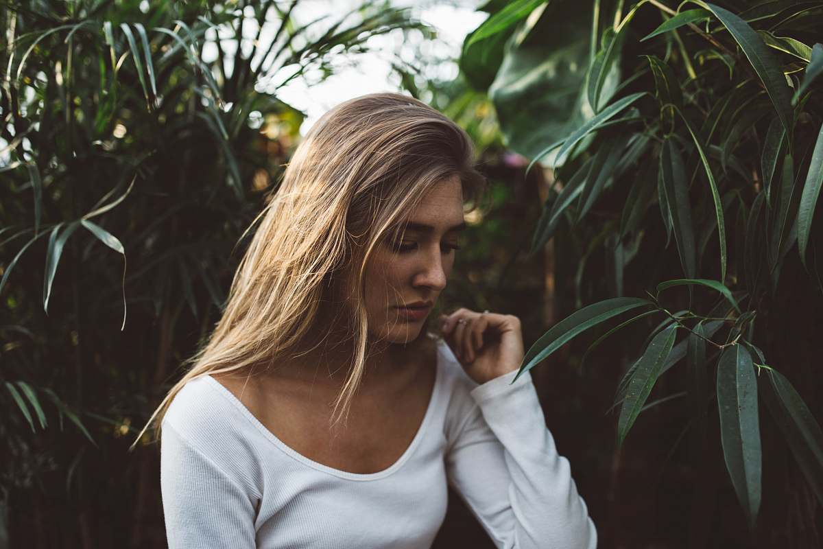 person woman near green leafed plants plant
