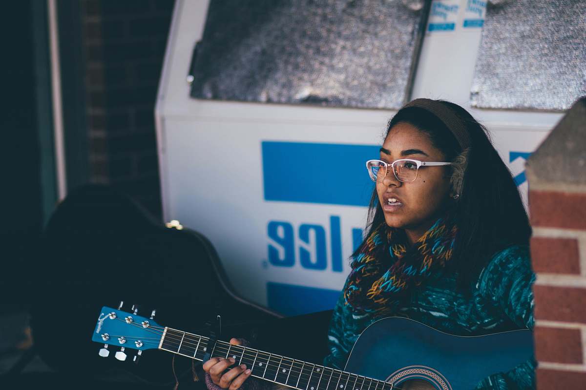female woman playing guitar guitar