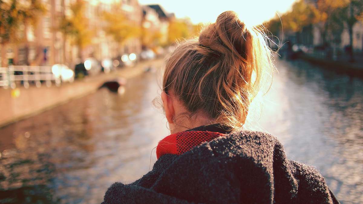 person woman standing in front of body of water leiden
