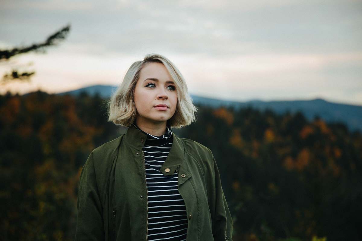 woman woman standing on top of mountain blonde