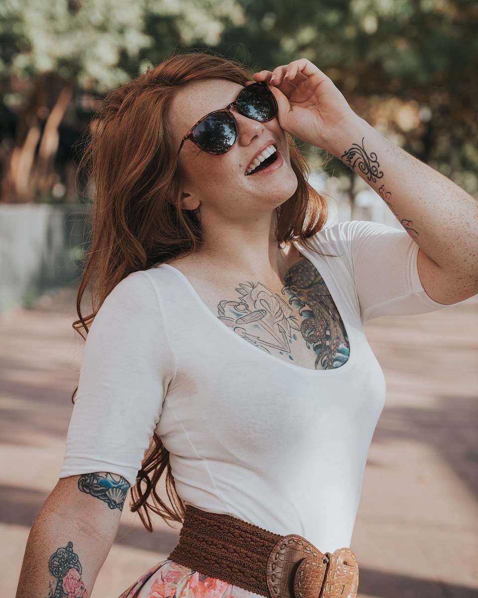 person woman touching her sunglasses during daytime human
