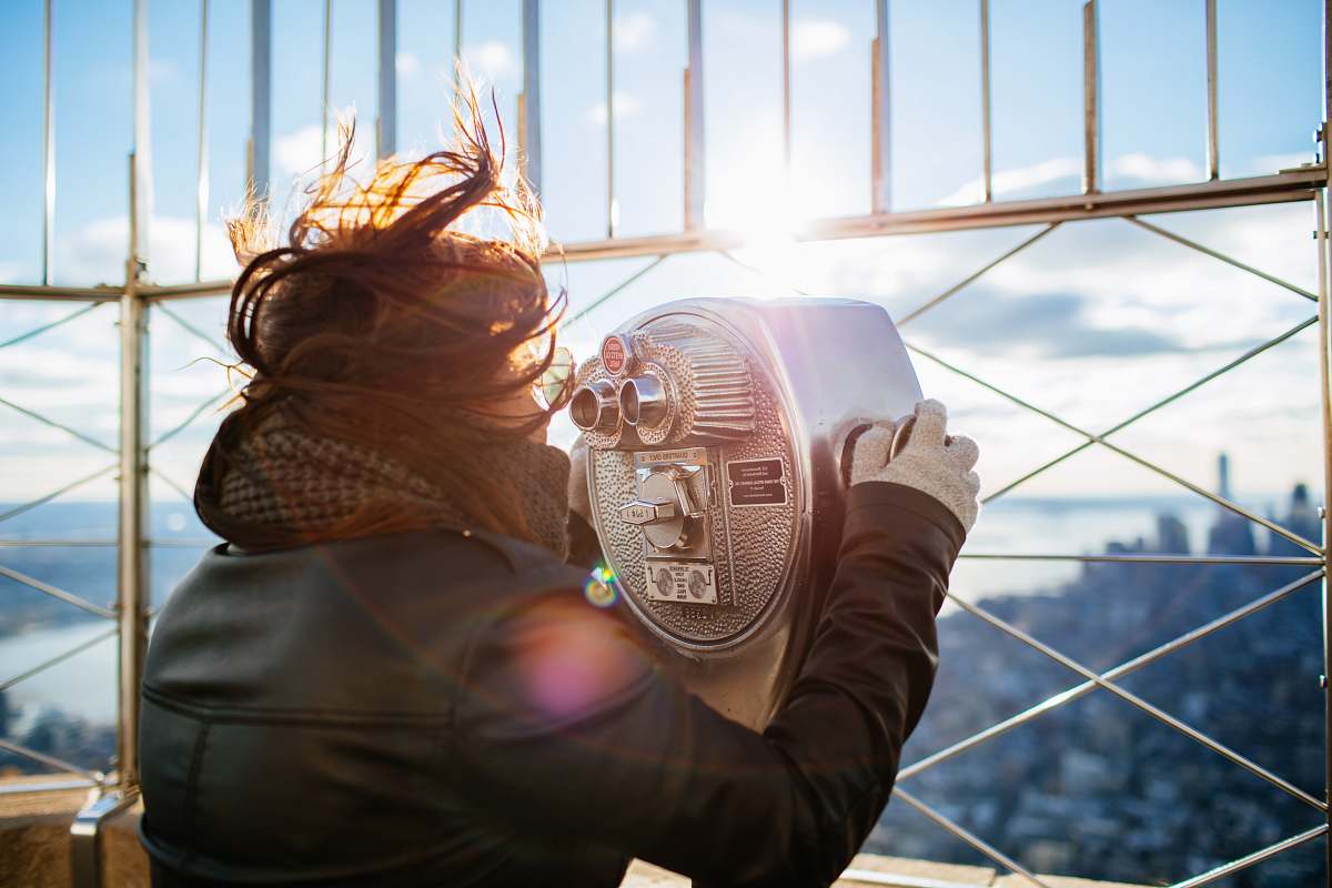 person woman using gray building binoculars human