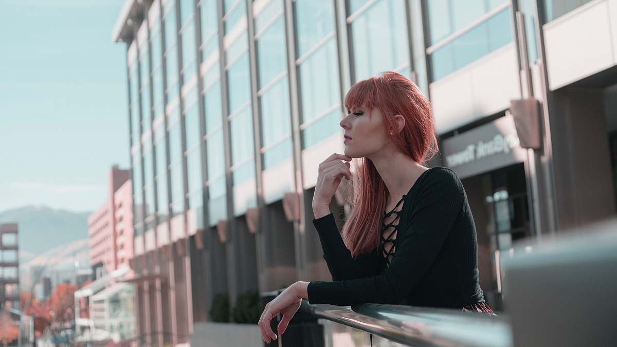 person woman wearing black sweater while being photograph human