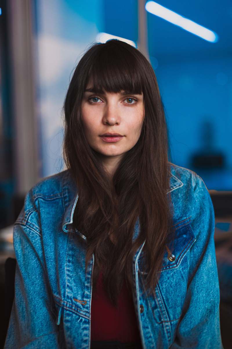 human woman wearing blue denim jacket person