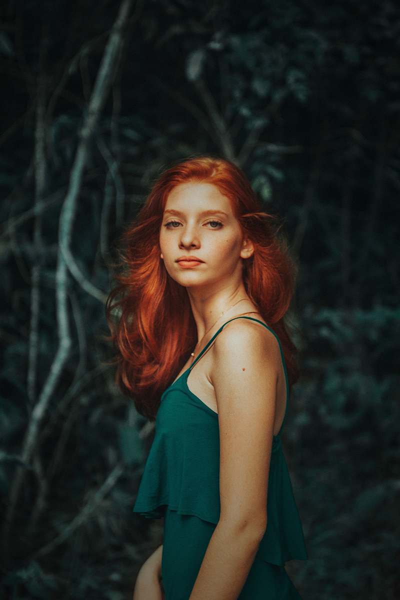 human woman wearing teal noodle strap dress woman