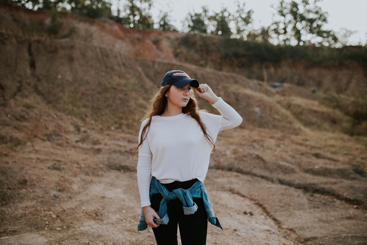 person woman wearing white boat-neck long-sleeved shirt human