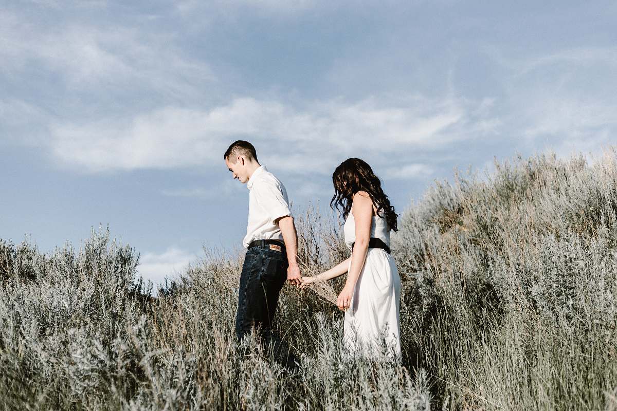 people couple walks of grassy field human