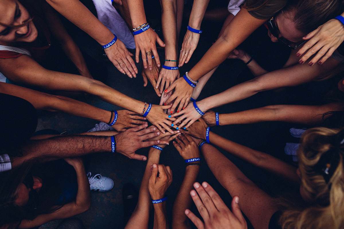 people group of people huddling human