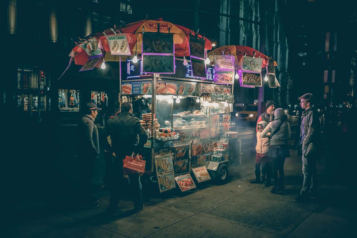 people group of people standing near food cart new york