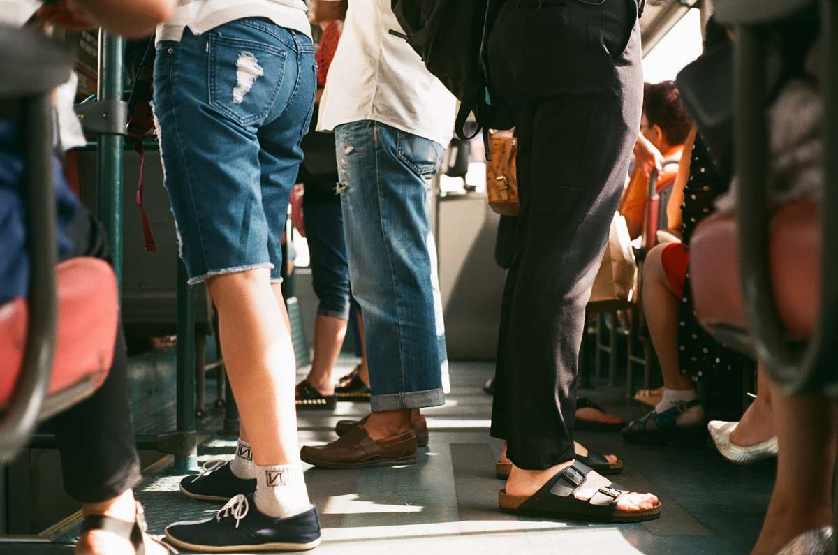 people group of person sitting and standing inside the vehicle bus