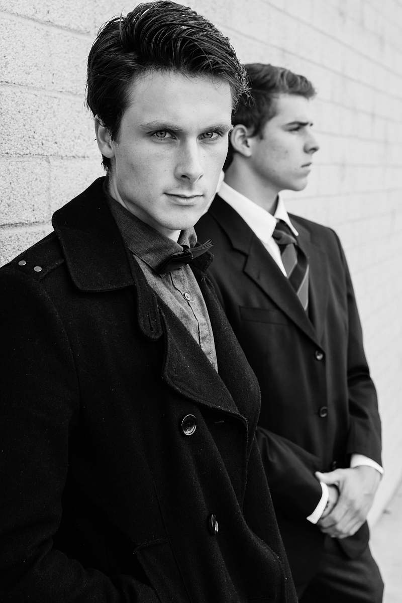 people man in black trench coat black-and-white