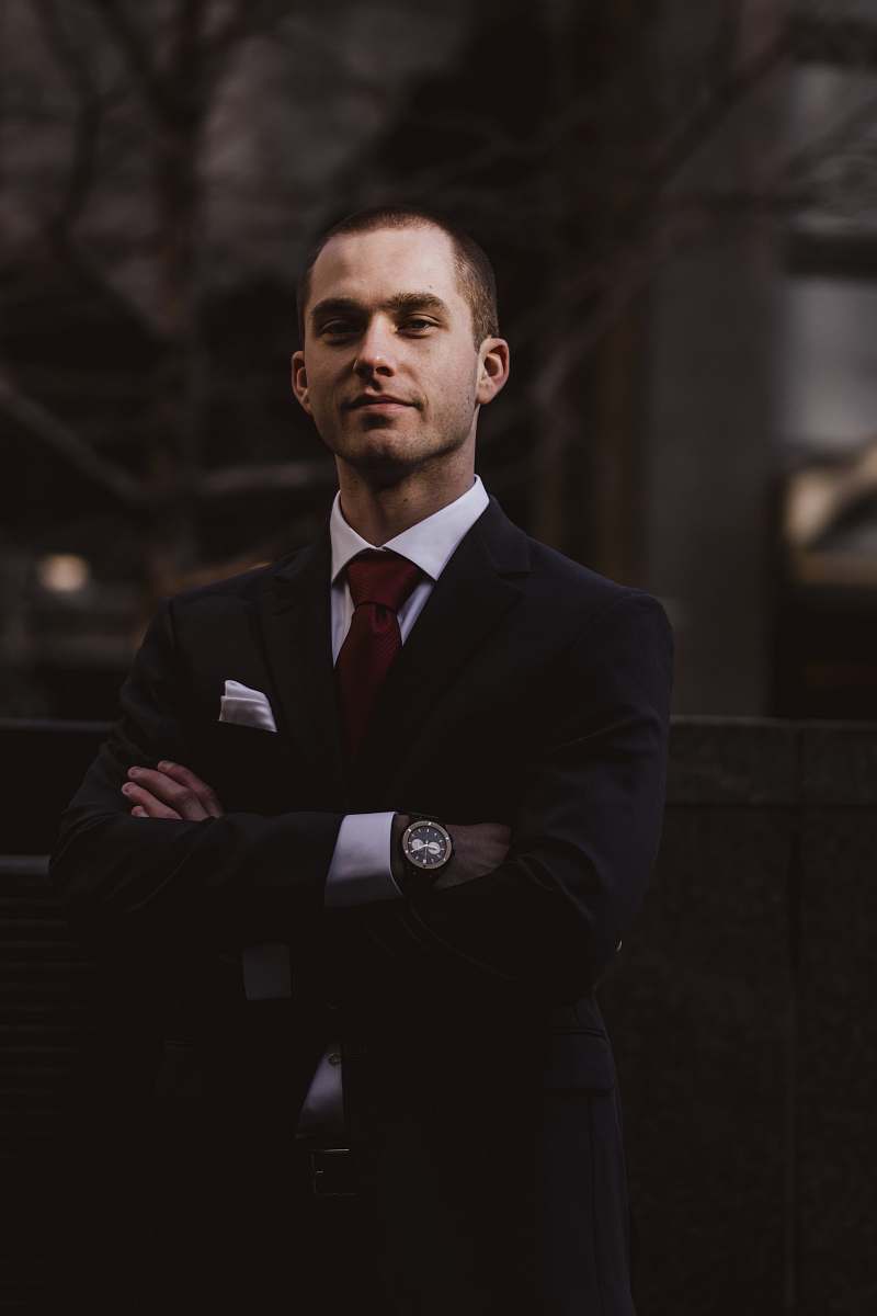 people man wearing black notched lapel suit jacket in focus photography human